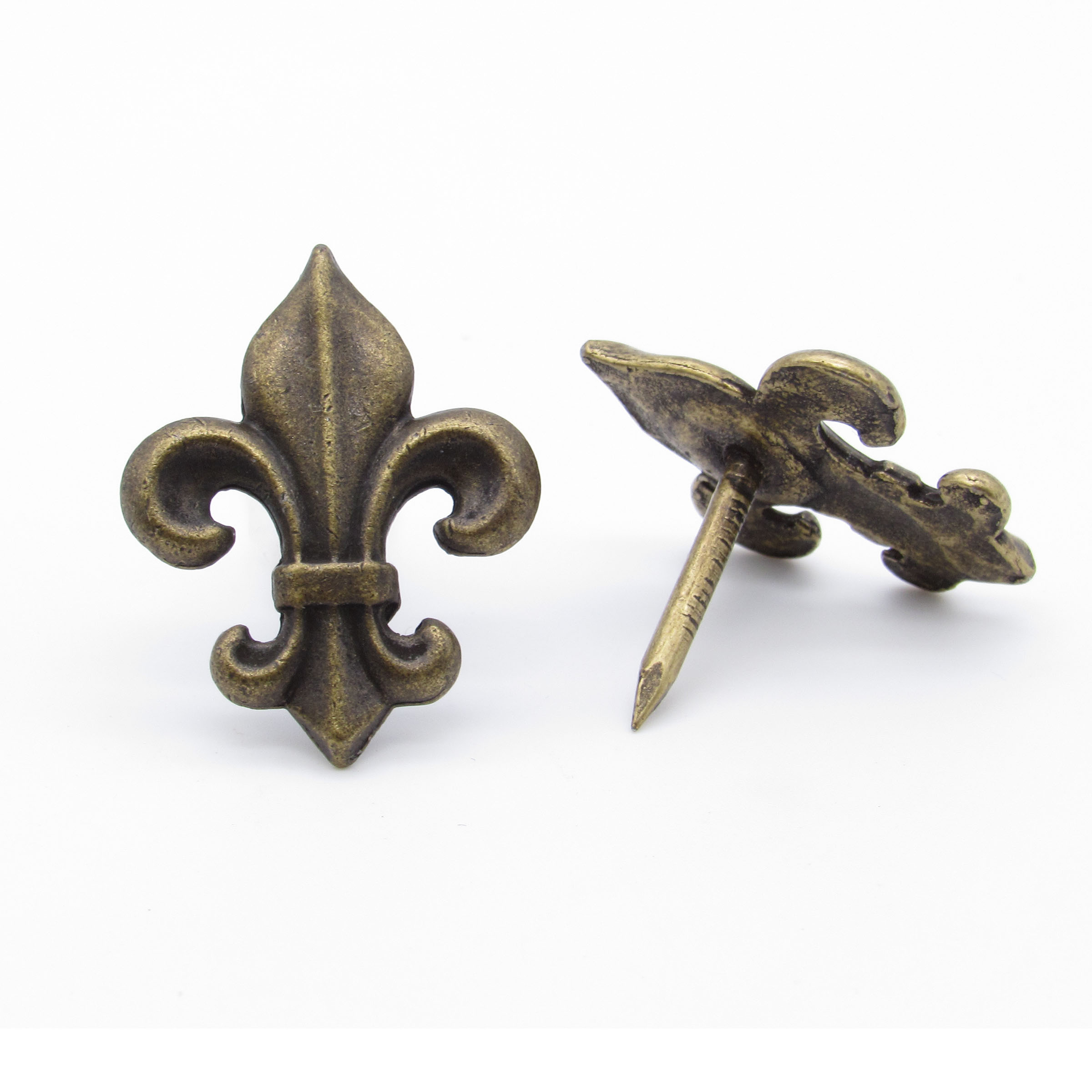 product: Buck Snort Lodge Small Fleur-de-lis Clavo Decorative Nail, 8-Pack, Brass Oxide shown